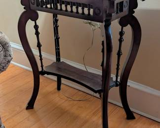 $100 Late Victorian Mahogany Side Table
The rectangular top over spindle carved apron, raised on cabriole legs joined by a lower shelf.
26 x 15 x height 31 in.