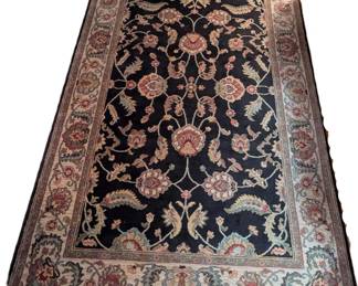 $100 Karastan Ashara Wool Carpet
Underside corner with label
In the Agra pattern, red, tan, green floral on black ground, with cotton fringe.
5 ft. 9 in. x 9 ft.
Acquired at Einstein Moomjy Carpets, Paramus, NJ circa 2008