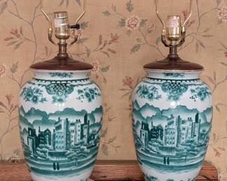 $150 Table Lamps: Pair of Chinese Painted Porcelain Baluster Vases, mounted as table lamps. Possibly Late 19th Century
Undersides with red six-character mark that translates to “Made during the Tongzhi reign of the Great Qing Dynasty”, The Tongzhi Emperor reigned from 1861 to 1875. Each painted with architectural landscapes in green over white porcelain, on wood stand. In good working order, (no shades).
Height of vase: 14 in.; diameter: 7 in. height overall: 26 in.