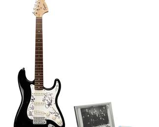 2080
A Fender "Squier Affinity" Stratocaster Guitar Signed by Chicago and Ephemera
Circa 2000
Guitar signed: Walt Parazaider / Tris Imboden / Keith Howland / Lee Loughnane / Robert Lamm / Jason Scheff / James Pankow / Bill Champlin
Together with a signed framed photograph, a size XL t-shirt from the band's 2000-2001 tour and two guitar picks
5 pieces
Guitar: 39.75" H x 13" W x 2.375" D; Photo framed: 9" H x 11.5" W x 0.875" D
The guitar accompanied by a Certificate of Authenticity from JSA/James Spence Authentication. No. YY91332, with matching label to body
Estimate: $1,000 - $1,500