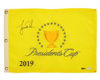 2064
Tiger Woods Autographed 2019 Presidents Cup Pin Flag
Edition 50/500
The small yellow pin flag with embroidered logo and signed upper left corner, with Upper Deck box
13.5" H x 19.5" W
Accompanied by a Certificate of Authenticity issued by Upper Deck Authenticated, numbered BAM160971 with matching holographic tag to item
Estimate: $2,000 - $3,000