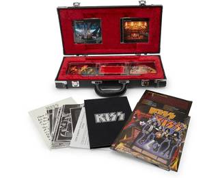 2081
KISS: "The Box Set" CDs 2001 Gene Simmons & Paul Stanley Signed Mini Guitar Case
Circa 2001
Comprising five compact discs, including thirty previously unreleased band and solo demos, outtakes and live recordings, as well as a hard-cover book featuring track-by-track commentary by KISS band members Gene, Paul, Ace, and Peter, detailed track information, rare photos and essay, all held within a black miniature guitar case with dedications and autographs of band members Gene Simmons and Paul Stanley to lid, in silver metallic pen
7 pieces total
Case: 9.5" H x 19.25" W x 3.5" D
Estimate: $200 - $400