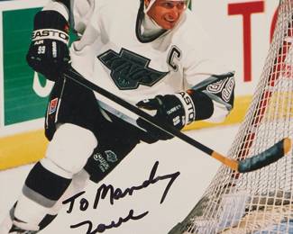 2063
A Wayne Gretzky LA Kings Signed NHL Photograph
Late 20th century
A framed signed photograph with dedication
Photo: 10" H x 8" W
Estimate: $200 - $300
