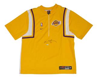 2002
Kobe Bryant 1999-2000 Lakers Autographed Warm-Up Embroidered Yellow Zip Up Jacket
The yellow Lakers Nike short-sleeved zip neck shooting shirt with signature and number to front in black ink, with Upper Deck box
2 pieces
Size L
Accompanied by a Certificate of Authenticity issued by Upper Deck Authenticated, no. BAG 04927, with matching holographic tags to item: BAG 04927.
Estimate: $1,500 - $2,000