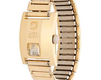 2071
Lord Elgin: An Elvis Presley Owned and Worn Wristwatch, 1950s
Dial: 8.6 mm rectangular dial and Arabic numerals
Model: Elvis Presley Direct Reading Jump Hour
Case: 28.0 mm, 14k gold filled
Closure: expandable mixed metal Speidel, USA band
Signed: front case with gold filled crest detail
Inner circumference: 7 in.
48.8 grams gross
Estimate: $8,000 - $12,000