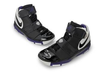 2011
Kobe Bryant Lakers 2007 Autographed Team Issued Nike Zoom 2 Orca Shoes
A pair of Nike sales CFM sample shoes in black and white leather with purple trim, each with two Velcro™ straps, and each with "24" and signature in silver metallic ink to toe box
2 pieces
Size: 14
Accompanied by a Letter of Authenticity from D.C. Sports Collectibles, Los Angeles, CA.
Estimate: $3,000 - $5,000