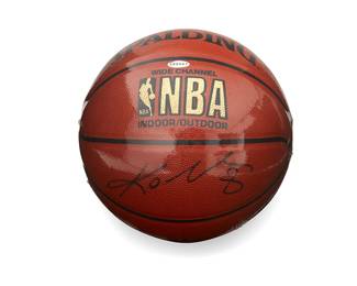 2034
Kobe Bryant Autographed Spalding Basketball
The NBA Indoor/Outdoor Wide Channel ball with signature in black ink, encased in plastic, with a custom display case
9.5" Dia. approximately
The ball accompanied by a Certificate of Authenticity from JSA/James Spence Authentication. No. ZZ67246.
Estimate: $1,500 - $2,000