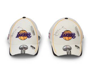 2027
Two Kobe Bryant Autographed Lakers Caps
Each official team cap signed in black ink to crown and with authenticity tags to brim interiors
Each: size L/XL
Accompanied by two Certificates of Verification issued by Ace Autograph Certification, Villa Park, CA; Nos: A26510 and A26511, with matching tags to items
With NBA tags: 121975661 & 121975662
Estimate: $2,500 - $3,000