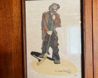 Framed cross-stitch of Emmett Kelly Jr. as Weary Willie, "Sweeping Up the Spotlight"