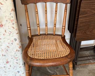 vintage spindle-back dining chair with a caned seat
