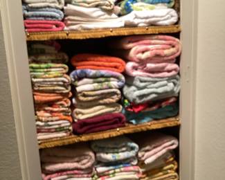 Lots of bath towels, hand towels and kitchen towels.