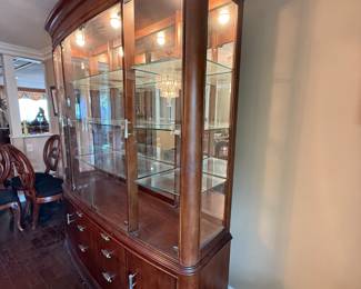 American Drew Advocate Series dining table, lighted hutch and granite-top buffet available for presale. Call 562-254-2597 for details.