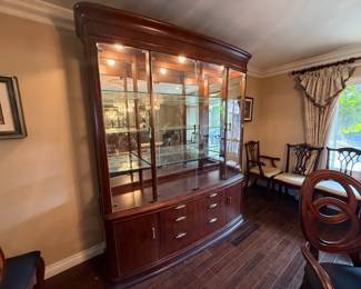 American Drew Advocate Series dining table, lighted hutch and granite-top buffet available for presale. Call 562-254-2597 for details.