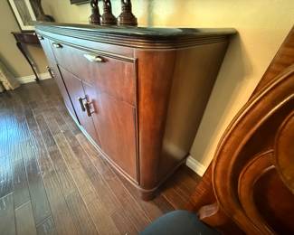 American Drew Advocate Series dining table, lighted hutch and granite-top buffet available for presale. Call 562-254-2597 for details.