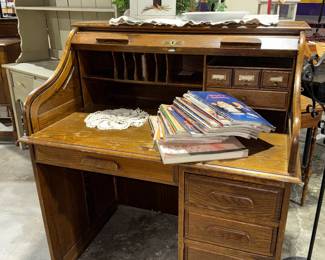 Roll top desk, books, magazines, church