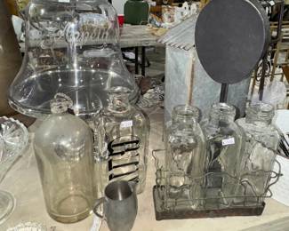 Cake stand, bottles, glass