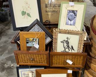 assorted framed pictures, rattan side table