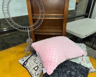 Display cabinet, pillows, wreath holder