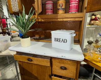 Hutch, plants, tins