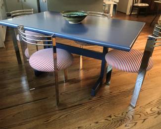 Postmodern Memphis style three-legged dining chairs and blue-painted trestle table