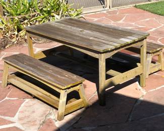 Rustic children's wooden picnic table and benches