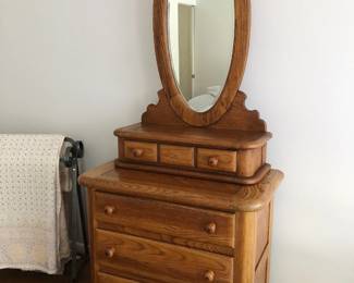 Vintage oak dresser with beveled oval mirror