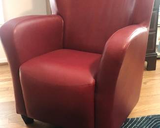 Red faux leather club chair