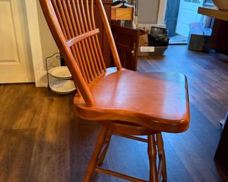 Two counter height Windsor style stools that swivel.