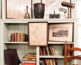 Antique leather fire bucket, Ives "Palace" Still Bank, C.P. Bush kaleidoscope, vintage and antique books