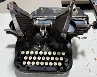 Oliver batwing typewriter. https://modestlambestatesales.hibid.com/