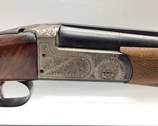 1964 EIG ITALIAN IMPORTED OVER UNDER 20 GA SHOTGUN 1964 EIG BRESCIA ITALY GARDONE V.T. REGION. THIS SHOTGUN IS A 20 GAUGE MAGNUM 3 INCH CHAMBERED. WONDERFUL METAL ENGRAVED OVER AND UNDER SHOTGUN. LOW ROUNDS PASSED THRU THE BARRELS. SIGNS OF WEAR ON THE STOCK AND PLASTIC BUTT PLATE IS CRACKED BEYOND REPAIR. SIMPLE FIX. FFL OR NICS CHECK REQUIRED