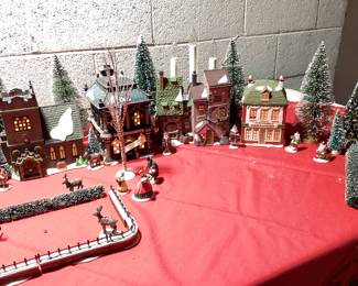 9 PC DICKENSâ€™ VILLAGE COLLECTION CHRISTMAS DECOR HERITAGE VILLAGE COLLECTION WITH LIGHTS INCLUDING CHARLES DICKENS CHRISTMAS CARROL VILLAGE, ADDITIONAL HVC MINIATURES AND FLOCKED LANDSCAPE AND WINDOW LIGHTED CANDLES. COMPLETE CHRISTMAS VILLAGE DECORATION IN ONE LOT. VILLAGE HAVE ORIGINAL BOXES