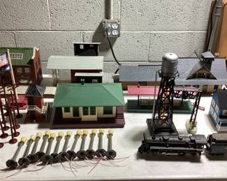  LARGE LIONEL O & O27 GAUGE TRAIN COLLECTION THIS LOT FEATURES THE LIONEL 6-11906 COMPLETE SET WITH ENGINE AND FUNCTIONAL. ALSO INCLUDES SANTE FE ENGINE(NEEDS SERVICE AND OILING) EXTRA CARS, DEPOT STATIONS, GATEMAN, ATLAS CONNECTORS, SWITCH TRACKS, MINIATURE PEOPLE AND LIVE STOCK, APPROX. 75 FEET OF TRACKS, EXTRA TRANSFORMER, STREET LIGHT AND LIGHTING CONTROLLER, ADDITIONAL STRUCTURES AND MORE