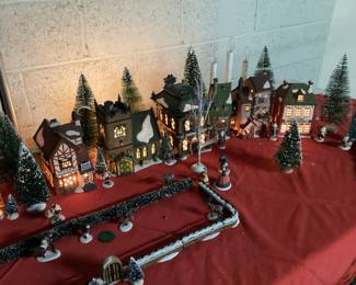 9 PC DICKENSâ€™ VILLAGE COLLECTION CHRISTMAS DECOR HERITAGE VILLAGE COLLECTION WITH LIGHTS INCLUDING CHARLES DICKENS CHRISTMAS CARROL VILLAGE, ADDITIONAL HVC MINIATURES AND FLOCKED LANDSCAPE AND WINDOW LIGHTED CANDLES. COMPLETE CHRISTMAS VILLAGE DECORATION IN ONE LOT. VILLAGE HAVE ORIGINAL BOXES