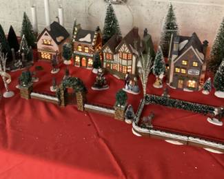 9 PC DICKENSâ€™ VILLAGE COLLECTION CHRISTMAS DECOR HERITAGE VILLAGE COLLECTION WITH LIGHTS INCLUDING CHARLES DICKENS CHRISTMAS CARROL VILLAGE, ADDITIONAL HVC MINIATURES AND FLOCKED LANDSCAPE AND WINDOW LIGHTED CANDLES. COMPLETE CHRISTMAS VILLAGE DECORATION IN ONE LOT. VILLAGE HAVE ORIGINAL BOXES