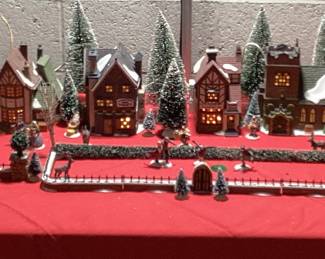 9 PC DICKENSâ€™ VILLAGE COLLECTION CHRISTMAS DECOR HERITAGE VILLAGE COLLECTION WITH LIGHTS INCLUDING CHARLES DICKENS CHRISTMAS CARROL VILLAGE, ADDITIONAL HVC MINIATURES AND FLOCKED LANDSCAPE AND WINDOW LIGHTED CANDLES. COMPLETE CHRISTMAS VILLAGE DECORATION IN ONE LOT. VILLAGE HAVE ORIGINAL BOXES