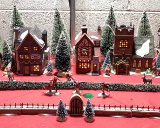 9 PC DICKENSâ€™ VILLAGE COLLECTION CHRISTMAS DECOR HERITAGE VILLAGE COLLECTION WITH LIGHTS INCLUDING CHARLES DICKENS CHRISTMAS CARROL VILLAGE, ADDITIONAL HVC MINIATURES AND FLOCKED LANDSCAPE AND WINDOW LIGHTED CANDLES. COMPLETE CHRISTMAS VILLAGE DECORATION IN ONE LOT. VILLAGE HAVE ORIGINAL BOXES