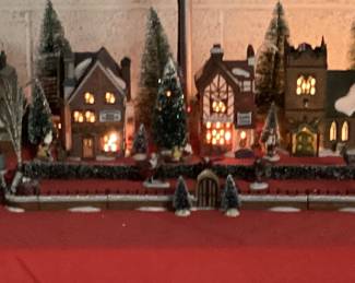 9 PC DICKENSâ€™ VILLAGE COLLECTION CHRISTMAS DECOR HERITAGE VILLAGE COLLECTION WITH LIGHTS INCLUDING CHARLES DICKENS CHRISTMAS CARROL VILLAGE, ADDITIONAL HVC MINIATURES AND FLOCKED LANDSCAPE AND WINDOW LIGHTED CANDLES. COMPLETE CHRISTMAS VILLAGE DECORATION IN ONE LOT. VILLAGE HAVE ORIGINAL BOXES