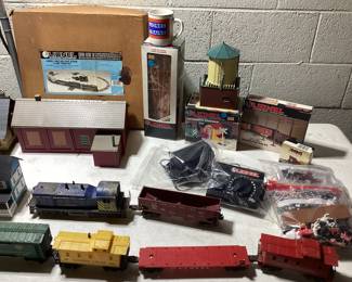  LARGE LIONEL O & O27 GAUGE TRAIN COLLECTION THIS LOT FEATURES THE LIONEL 6-11906 COMPLETE SET WITH ENGINE AND FUNCTIONAL. ALSO INCLUDES SANTE FE ENGINE(NEEDS SERVICE AND OILING) EXTRA CARS, DEPOT STATIONS, GATEMAN, ATLAS CONNECTORS, SWITCH TRACKS, MINIATURE PEOPLE AND LIVE STOCK, APPROX. 75 FEET OF TRACKS, EXTRA TRANSFORMER, STREET LIGHT AND LIGHTING CONTROLLER, ADDITIONAL STRUCTURES AND MORE