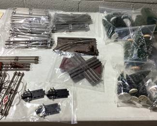  LARGE LIONEL O & O27 GAUGE TRAIN COLLECTION THIS LOT FEATURES THE LIONEL 6-11906 COMPLETE SET WITH ENGINE AND FUNCTIONAL. ALSO INCLUDES SANTE FE ENGINE(NEEDS SERVICE AND OILING) EXTRA CARS, DEPOT STATIONS, GATEMAN, ATLAS CONNECTORS, SWITCH TRACKS, MINIATURE PEOPLE AND LIVE STOCK, APPROX. 75 FEET OF TRACKS, EXTRA TRANSFORMER, STREET LIGHT AND LIGHTING CONTROLLER, ADDITIONAL STRUCTURES AND MORE