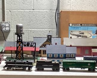  LARGE LIONEL O & O27 GAUGE TRAIN COLLECTION THIS LOT FEATURES THE LIONEL 6-11906 COMPLETE SET WITH ENGINE AND FUNCTIONAL. ALSO INCLUDES SANTE FE ENGINE(NEEDS SERVICE AND OILING) EXTRA CARS, DEPOT STATIONS, GATEMAN, ATLAS CONNECTORS, SWITCH TRACKS, MINIATURE PEOPLE AND LIVE STOCK, APPROX. 75 FEET OF TRACKS, EXTRA TRANSFORMER, STREET LIGHT AND LIGHTING CONTROLLER, ADDITIONAL STRUCTURES AND MORE