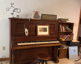 Antique upright piano and stool