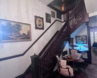 Many antique pictures a couple paintings, French Bergere chairs Victorian table