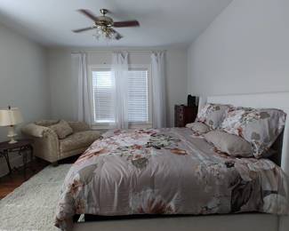 King size bed with white linen headboard, frame and mattress