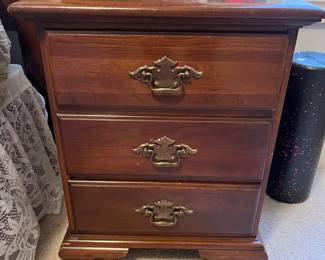 One of two matching nightstands by Young Hinkle.