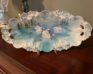 Antique hand-painted porcelain dish (Prussia) featuring three swans on a lake.