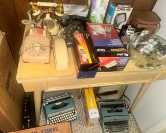 Rotary phones, midmod table, cameras, typewriters, all old school!