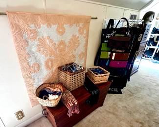 Another beautiful Hawaiian quilt and a cedar chest.