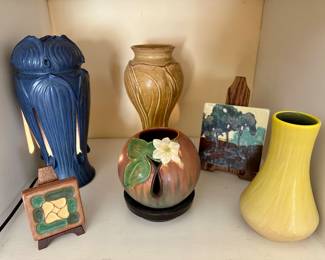 A beautiful blue Ephriam electric lantern, as well as other Ephriam pieces.  Pewabic vase back center.