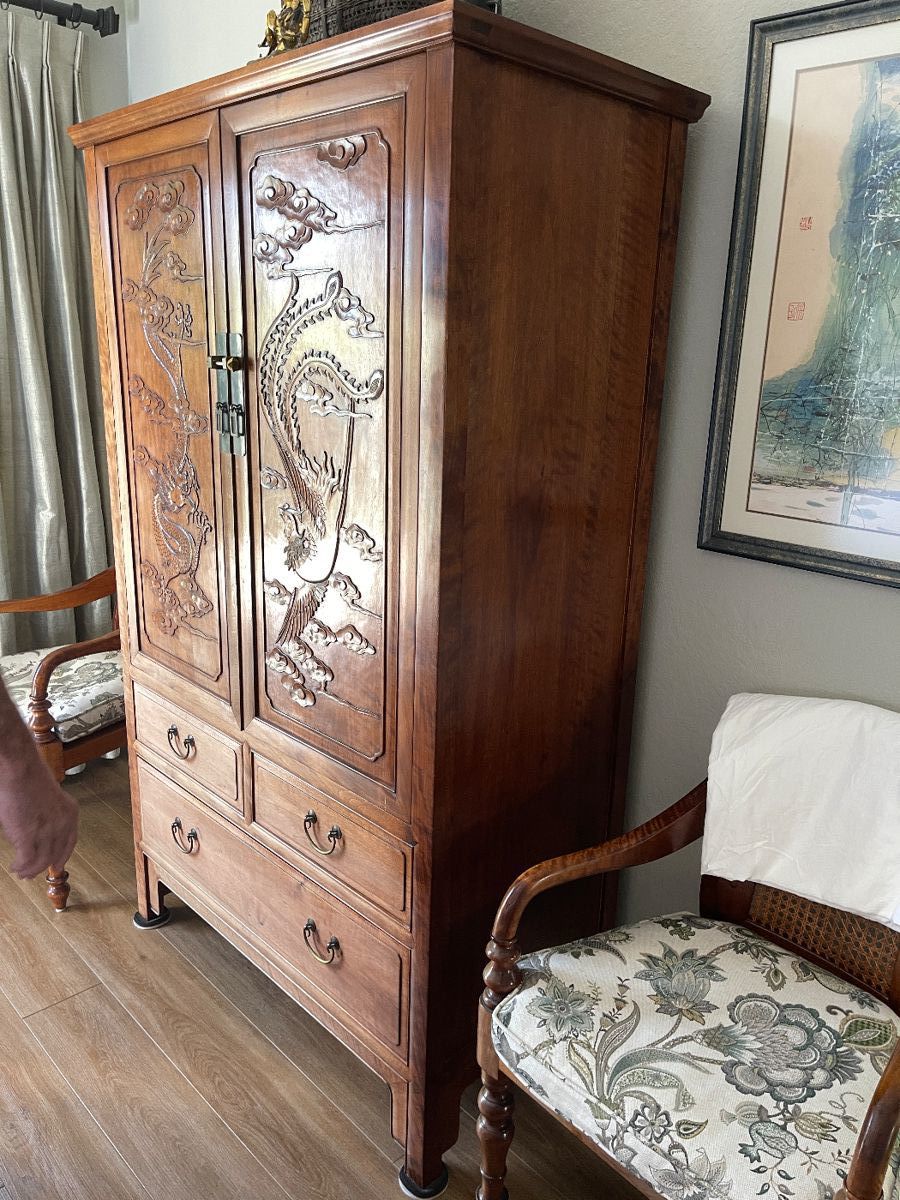 Chinese dragon phoenix cabinet - hardwood. Our sweet clients were part of the first group
Of American workers in China in the 1970s